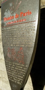 The metallic information panel put up by the Mayor of Paris outside the site of the Blute-Fin windmill in Montmartre. The text is in French and is translated in the body of the page text.