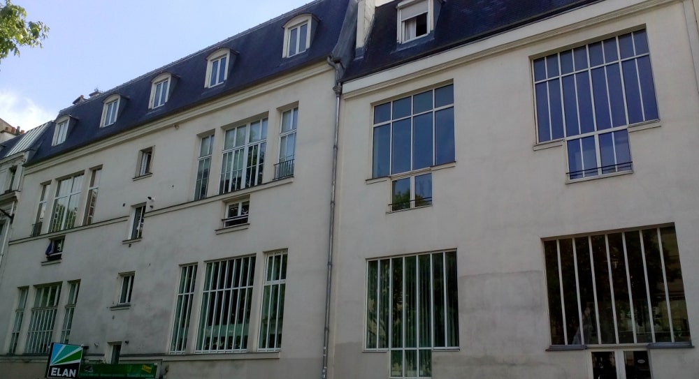 A view of the studio windows and large facade of 11 Boulevard de Clichy Montmartre. This is the studio where, along with Georges Braque, Picasso developed Cubism.