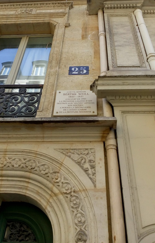 The plaque and a detail of the doorway and apartment building at 25 Rue Victor Massé Montmartre. This was where Berthe Weill opened in 1901 her modern art gallery. The plaque reads: “At this address Berthe Weill 1865 – 1951 opened, in 1901, the first art gallery for young upcoming artists. Her support facilitated the discovery of the avant-garde of modern art.”