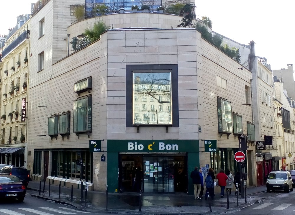 The Bio c’ Bon health food store on Place Pigalle, Montmartre. This is the site on the angle of Rue Jean-Baptiste Pigalle and Rue Frochot of the demolished Nouvelle Athènes (New Athens) café; an important meeting point for the Montmartre artistic community it later became a jazz venue.