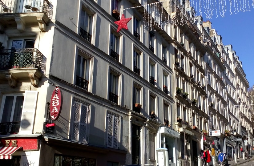 Winter sun picks out windows and balconies on Rue Ravignon Montmartre