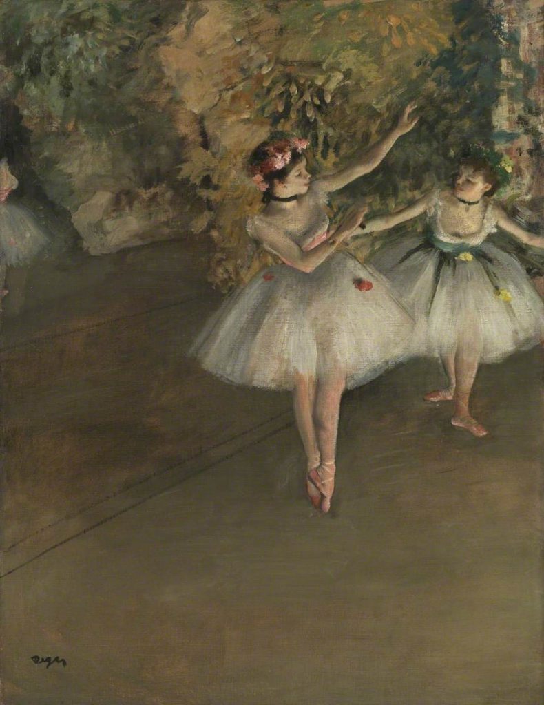 Degas' painting Two Dancers on a Stage. Two ballet dancers in full ballet dress enter onto the Paris Opera stage from the right. Degas has caught the dancers in mid movement. Their costumes and features lit by the stage lighting.